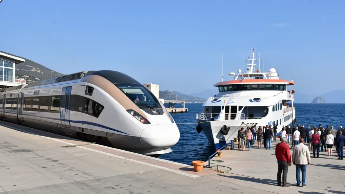 Generic image of a high-speed train and a ferry at a port, representing intermodality.