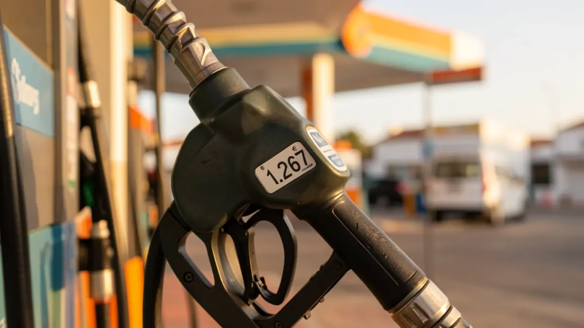 Close-up of a gasoline pump nozzle displaying 1.267 euros at a gas station in the Canary Islands.